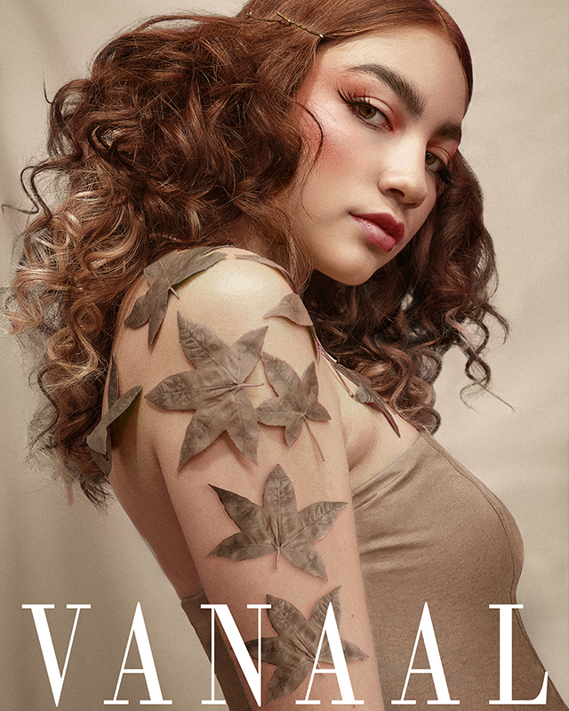 Black and white photograph of a man praying with a robe on his face and a chain in his hands.