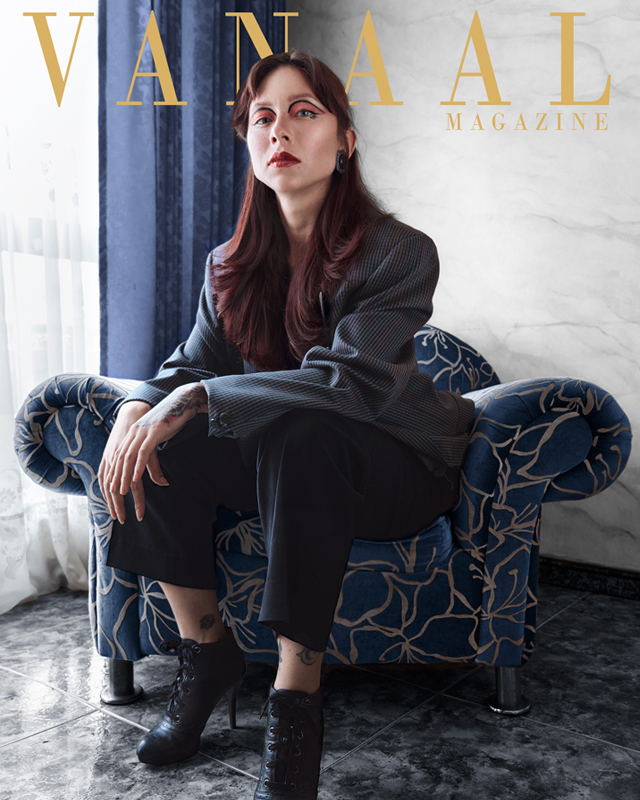 Black and white photograph nun in front of a giant window praying.
