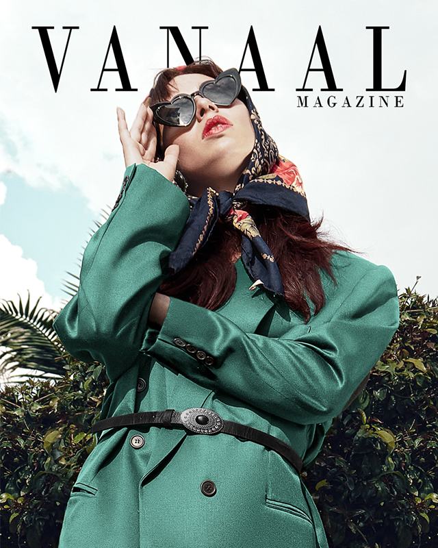 Black and white photograph of a man with his face completely covered by a blanket.