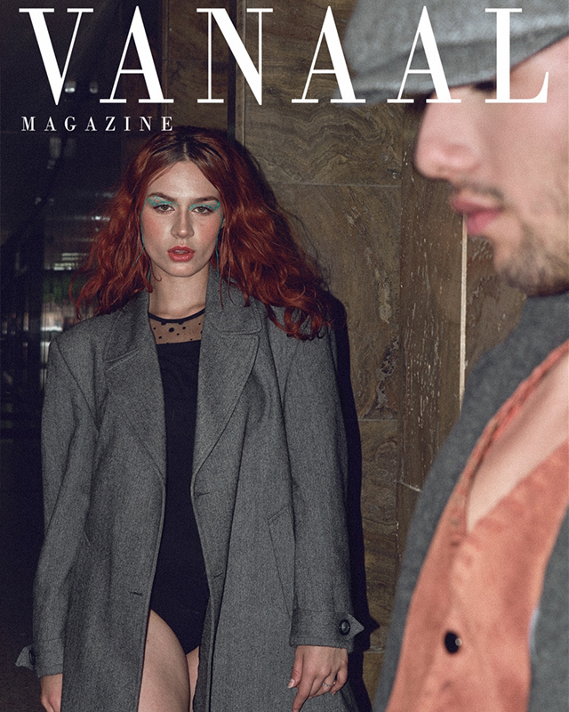 Black and white photograph of a nun covering her face with her hands.